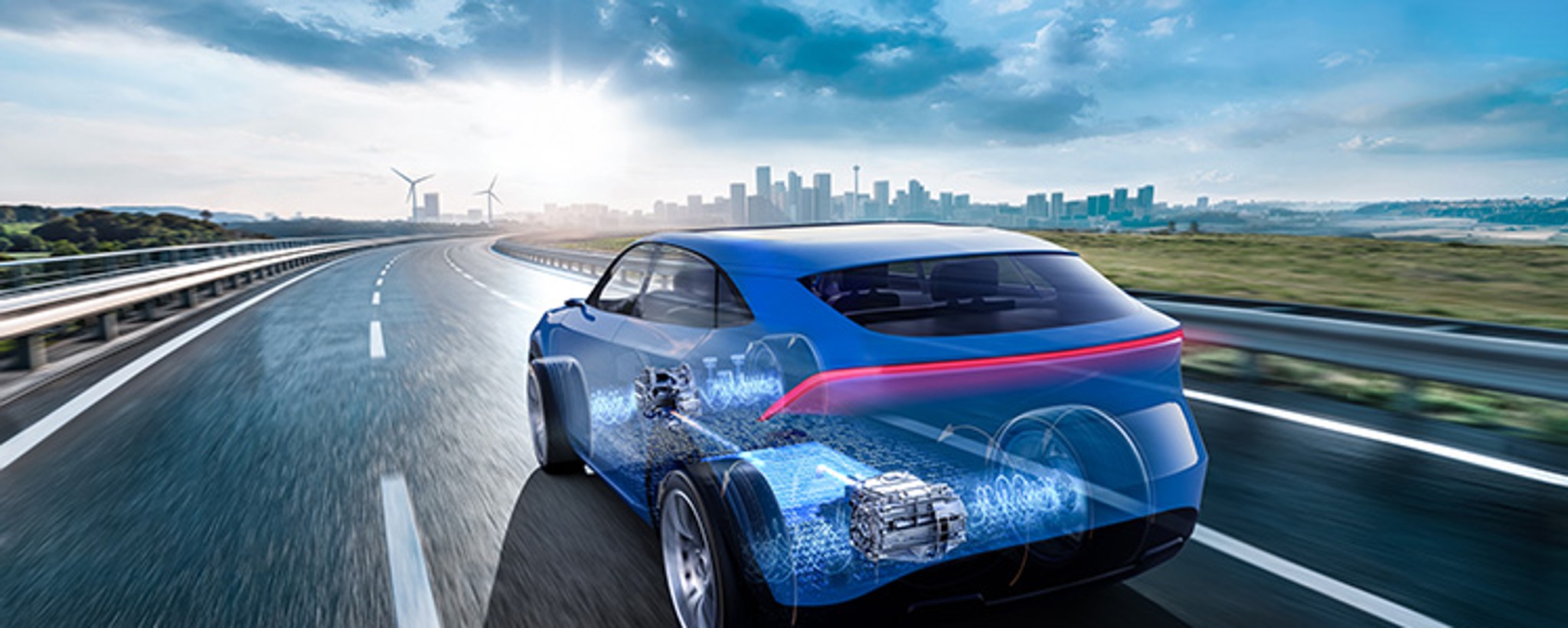Gläsernes Elektroauto auf einer Landstraße mit sichtbar dargestelltem E-Antrieb und Hochvoltbatterie.