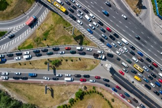 Many cars driving on the highway