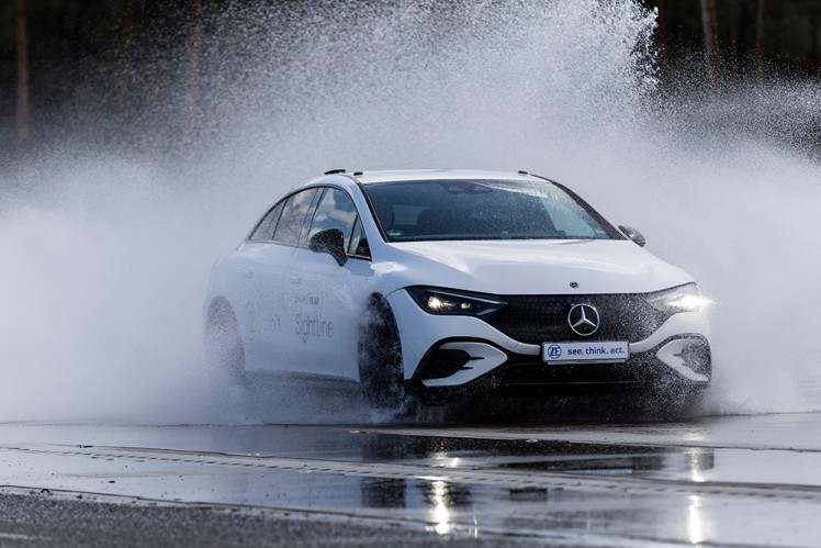 White care travelling through water and spraying car