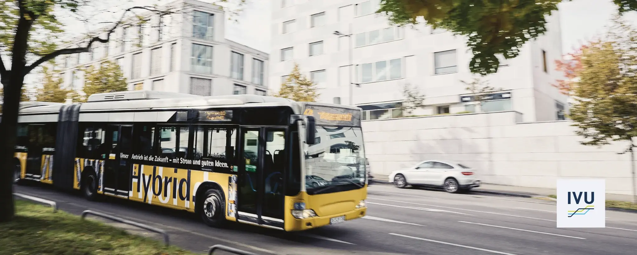 Yellow articulated bus on the street
