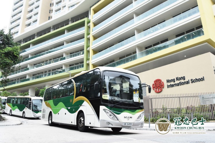 White and green city bus on a Hong Kong street
