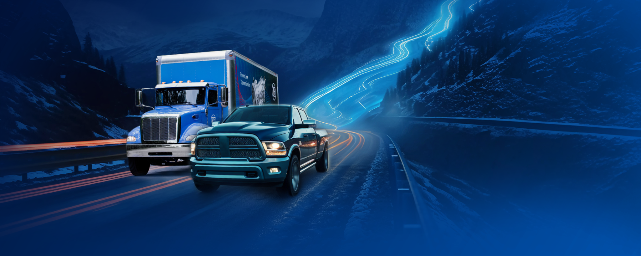 Medium-duty box truck with ZF PowerLine and Dodge Ram pickup truck on mountainous highway.