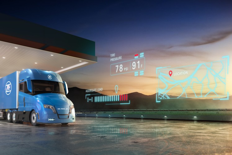 Truck showing smart trailer tracking data, including GPS location, tire pressure and temperature, and axle load weight.