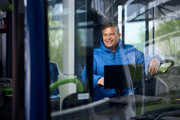 Bus fleet - man driving a bus