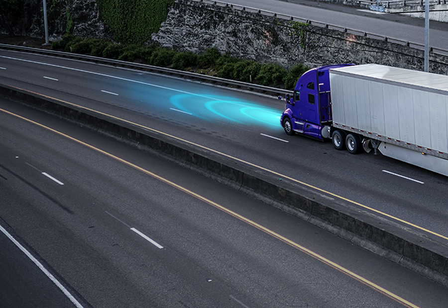 Semi truck on highway using advanced driver safety system with object detection technology.