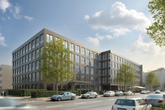 ZF Munich building in daylight with cars on the road in front and some trees