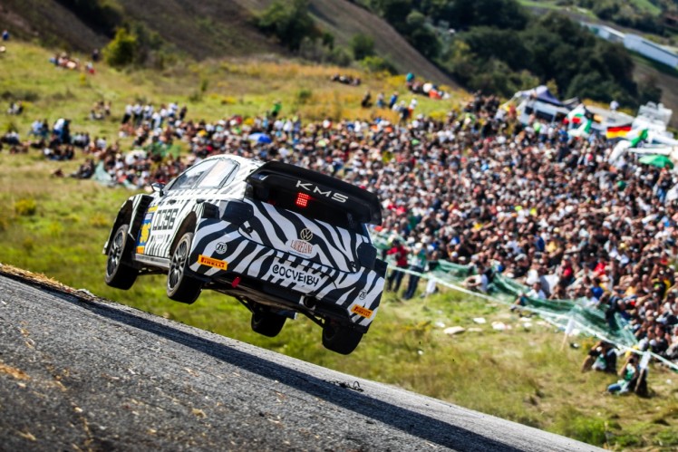 Car on track with wheels off floor