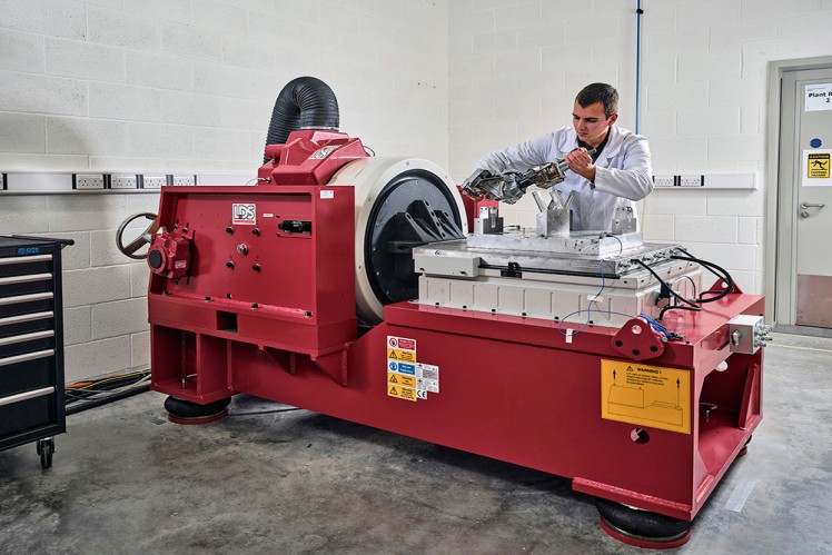 Engineering working on vibration unit