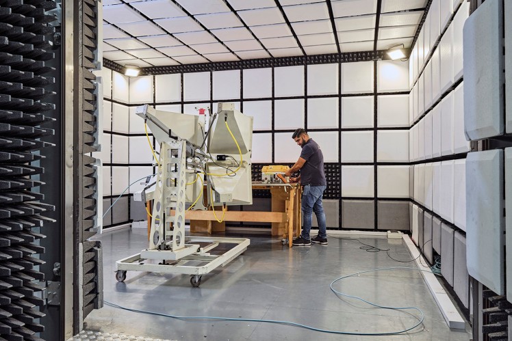 Person workng on test bench in EMC chamber