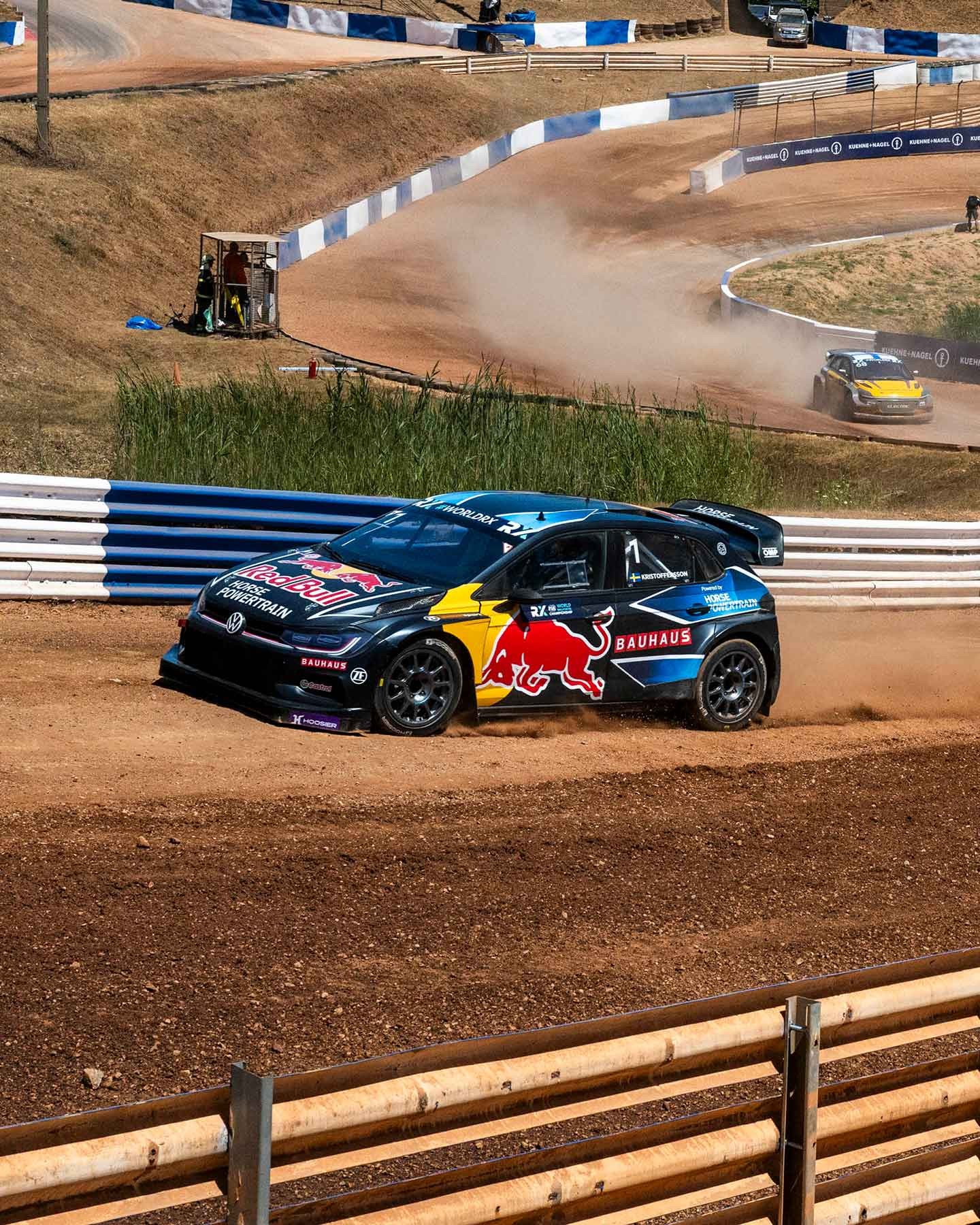 Blue car travelling on race track