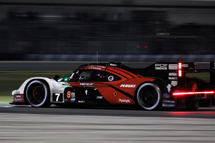 Hypercars driving at speed on race track