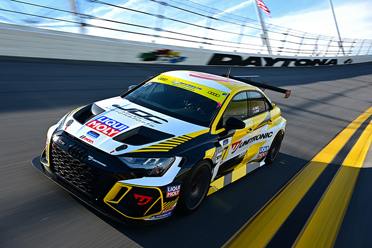 Touring car racing cornering on track