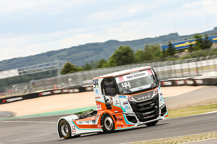 Truck racing on a track at an angle