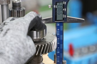 Part on bench being measured